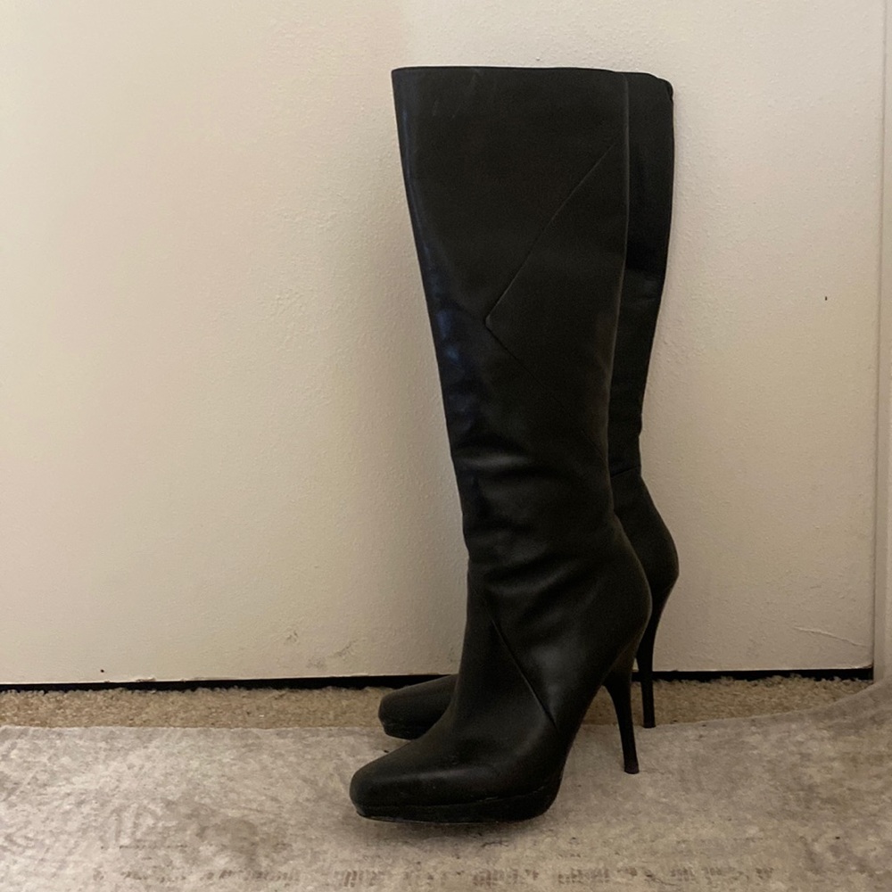 Via Spiga black high heeled platform dress boots.